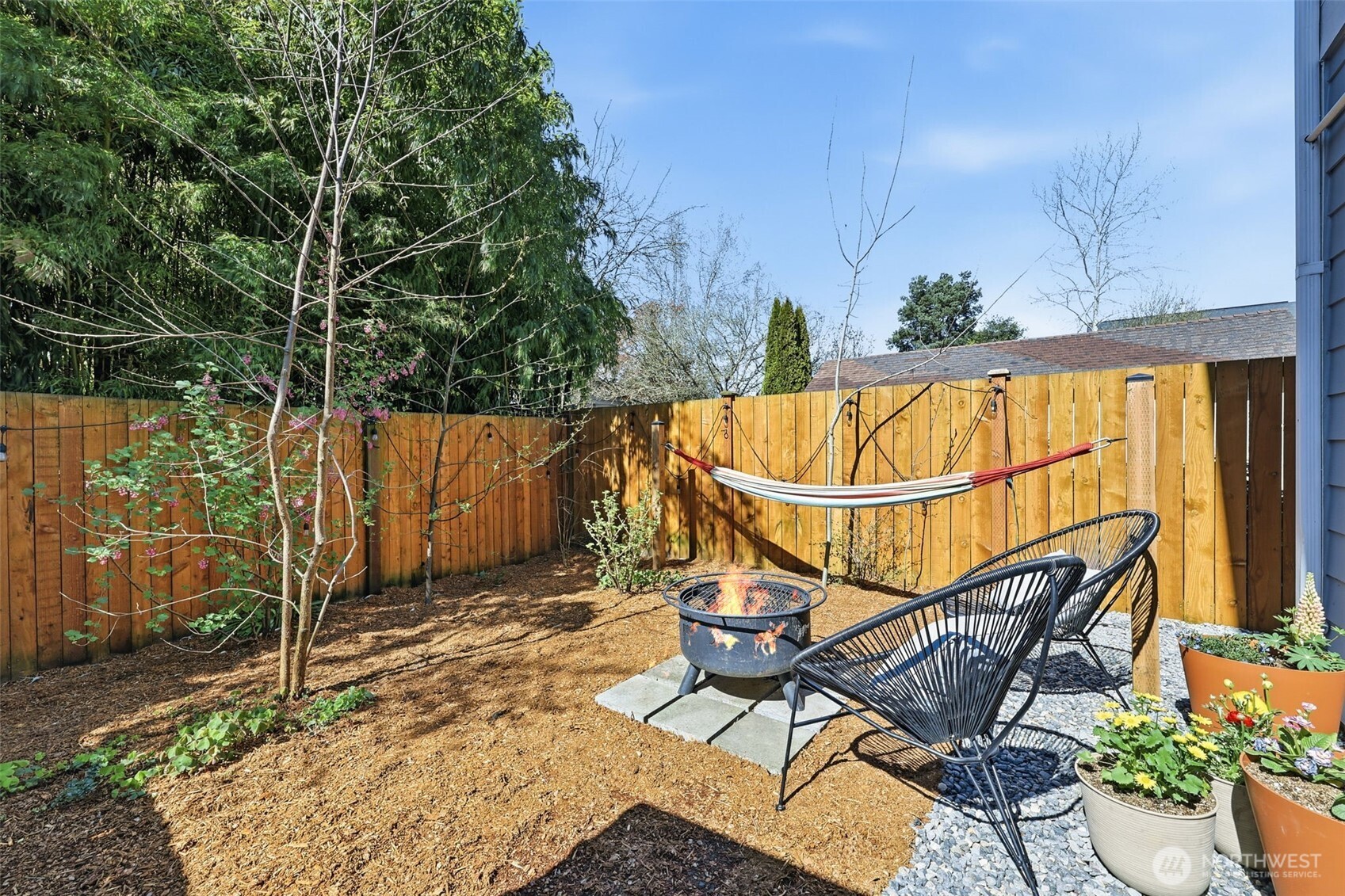8847 9th Avenue Southwest, Unit A Seattle, WA 98106 - Photo 23 of 31 a view of a chairs and table in the backyard