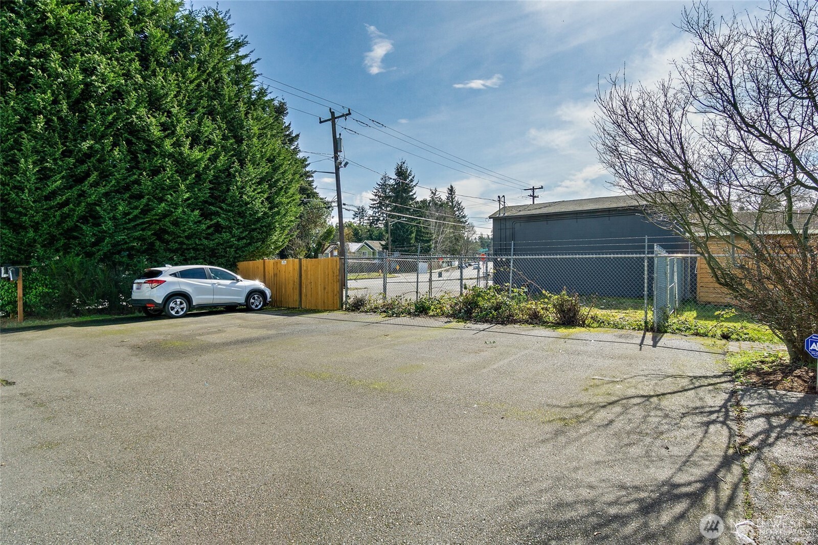 8847 9th Avenue Southwest, Unit A Seattle, WA 98106 - Photo 28 of 31 a car parked in front of house