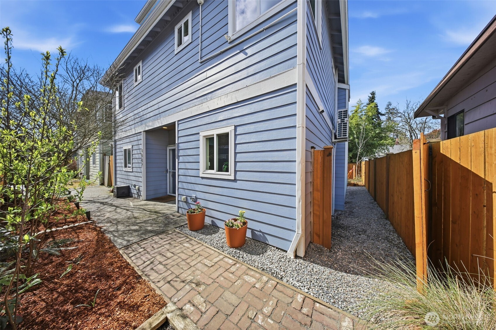 8847 9th Avenue Southwest, Unit A Seattle, WA 98106 - Photo 5 of 31 a view of a house with backyard and sitting area