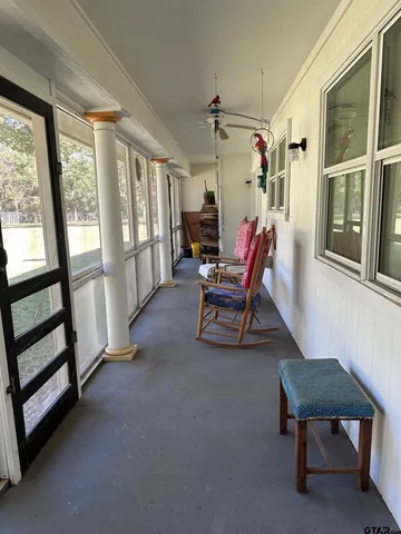 a view of a livingroom with furniture and a window