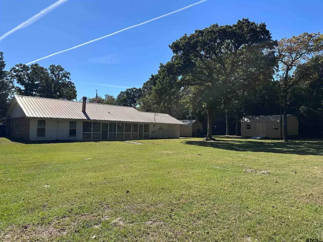 a swimming pool with wooden fence