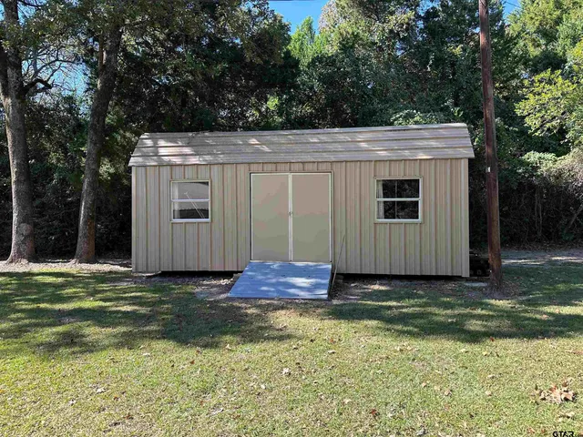 a view of a backyard of the house