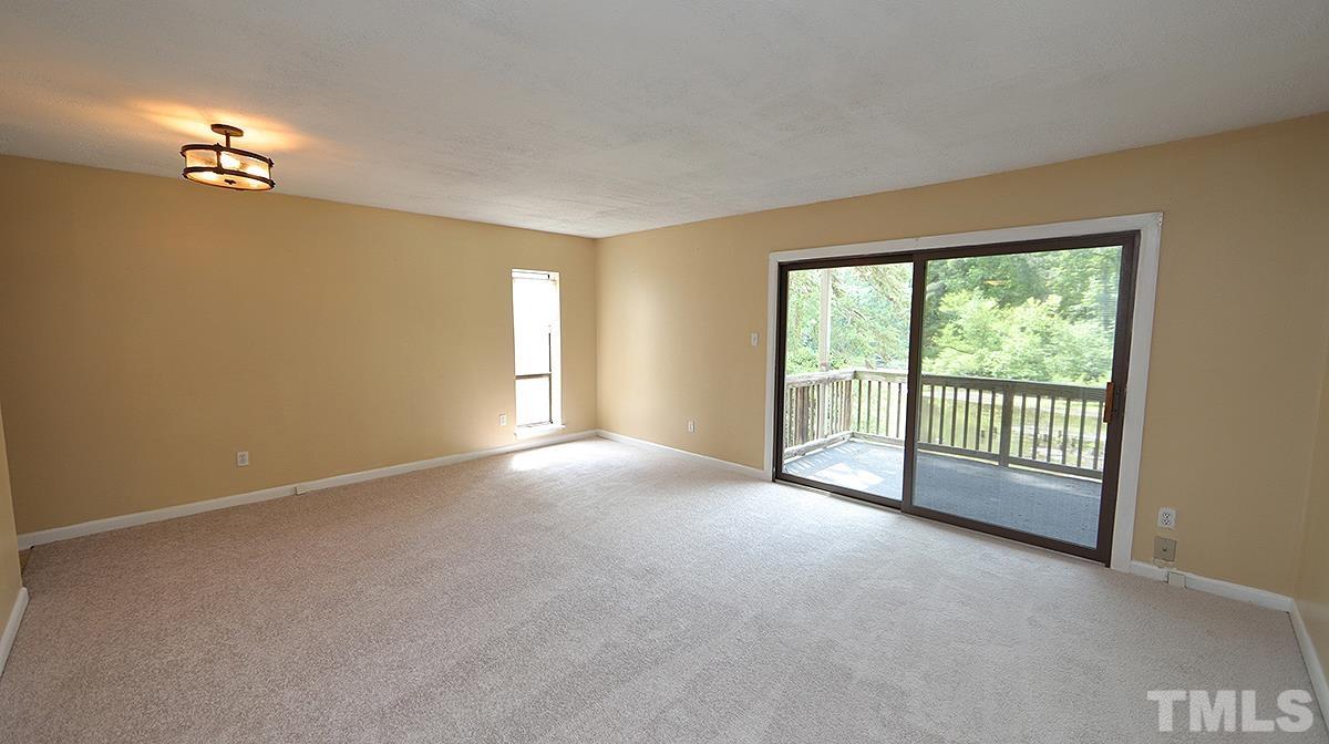 612 Pine Ridge Place, Unit 612 Raleigh, NC 27609 - Photo 4 of 12 a view of an empty room with a window