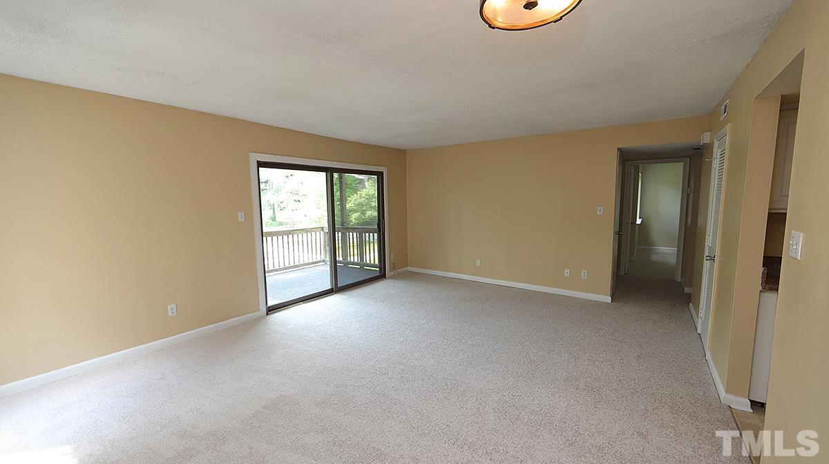 612 Pine Ridge Place, Unit 612 Raleigh, NC 27609 - Photo 5 of 12 an empty room with windows