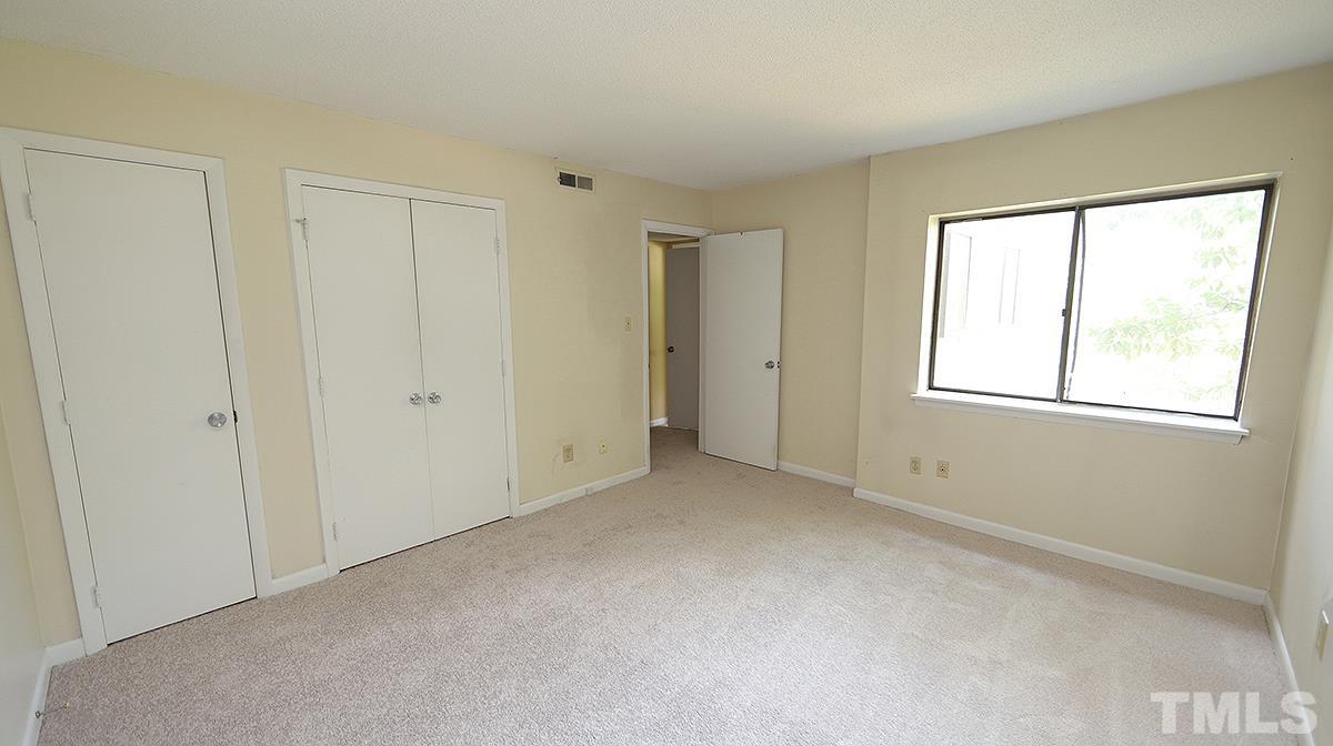 612 Pine Ridge Place, Unit 612 Raleigh, NC 27609 - Photo 7 of 12 a view of an empty room with a window