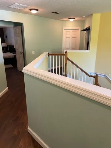 a view of balcony with furniture