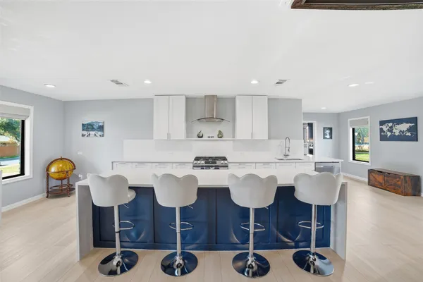 a view of kitchen island dining table and wooden floor