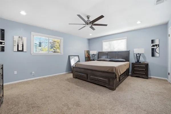 a bedroom with a bed and window