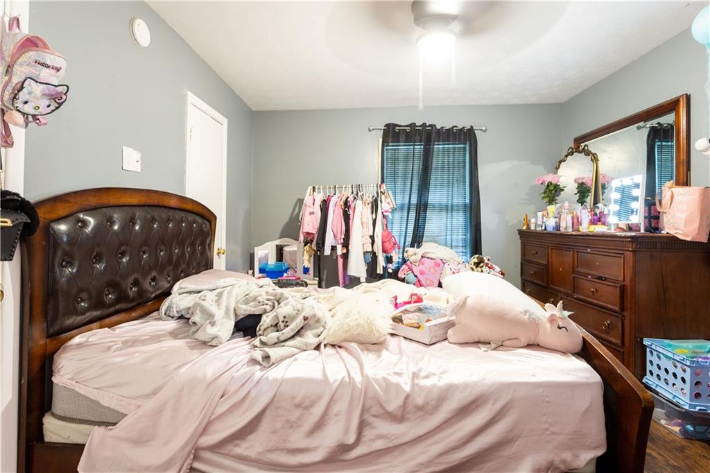1535 Flat Shoals Road Southwest Conyers, GA 30094 - Photo 19 of 21 a bedroom with a bed and a dresser