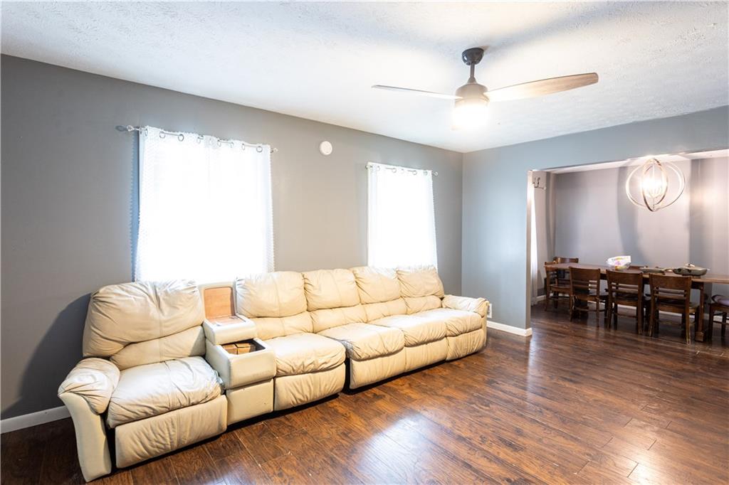1535 Flat Shoals Road Southwest Conyers, GA 30094 - Photo 20 of 21 a living room with furniture and wooden floor