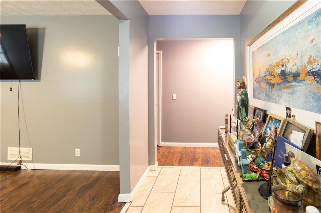 1535 Flat Shoals Road Southwest Conyers, GA 30094 - Photo 2 of 21 a view of a livingroom with furniture and a flat screen tv