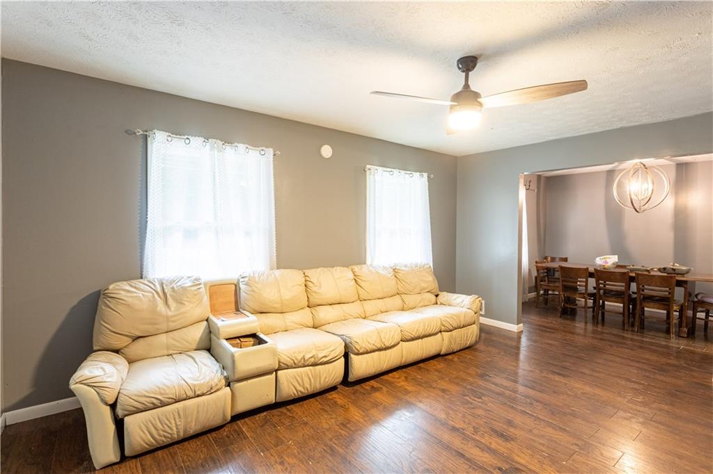 1535 Flat Shoals Road Southwest Conyers, GA 30094 - Photo 21 of 21 a living room with furniture and wooden floor