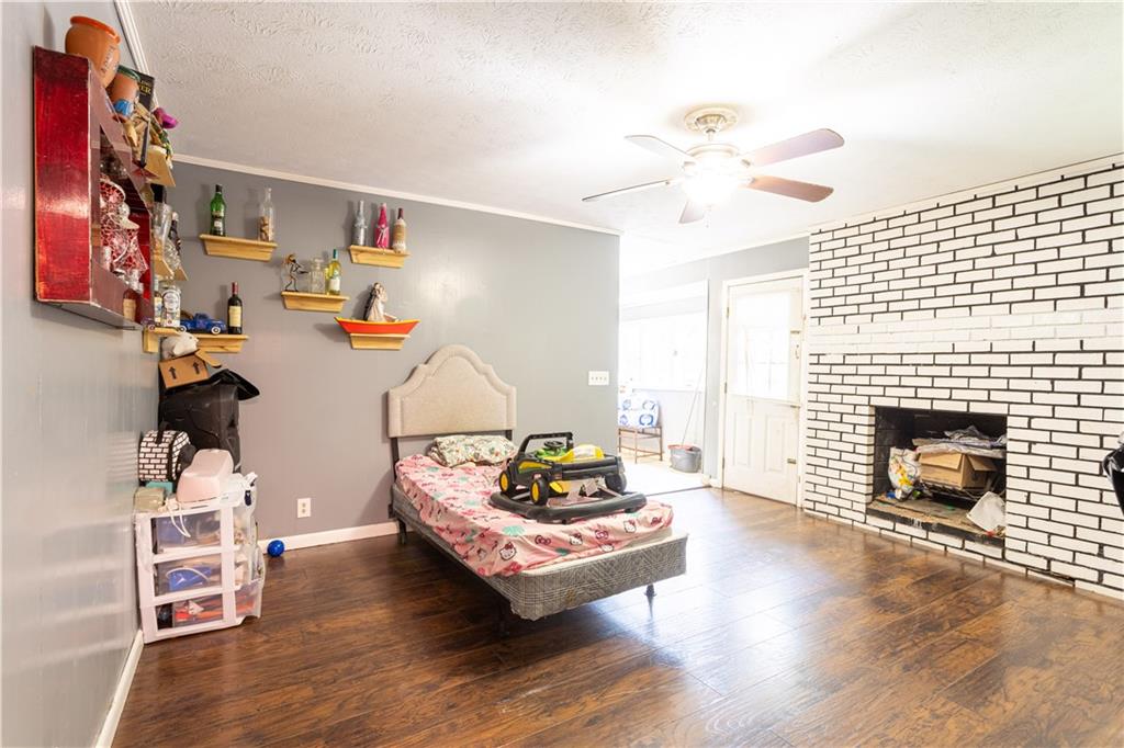 1535 Flat Shoals Road Southwest Conyers, GA 30094 - Photo 8 of 21 a living room with furniture and a fireplace