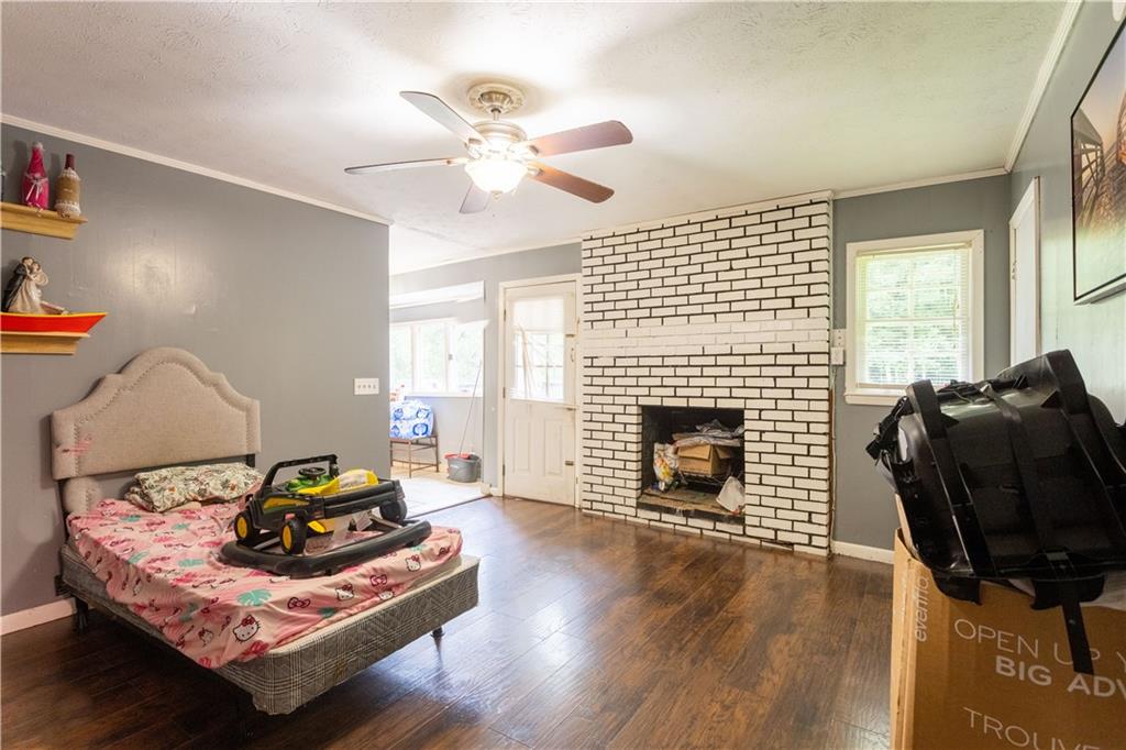 1535 Flat Shoals Road Southwest Conyers, GA 30094 - Photo 9 of 21 a living room with furniture and a fireplace