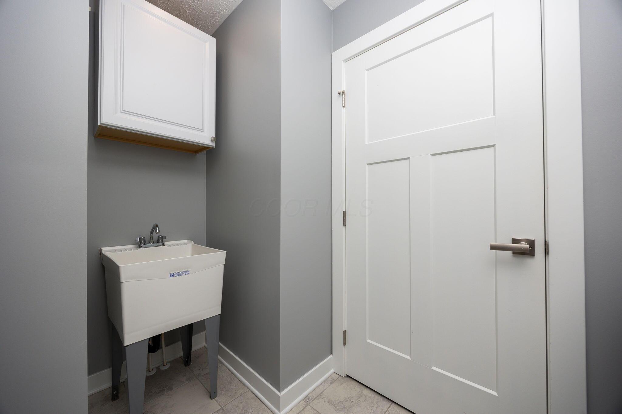 206 Talla Road South Delaware, OH 43015 - Photo 32 of 58 First floor laundry w/ utility sink