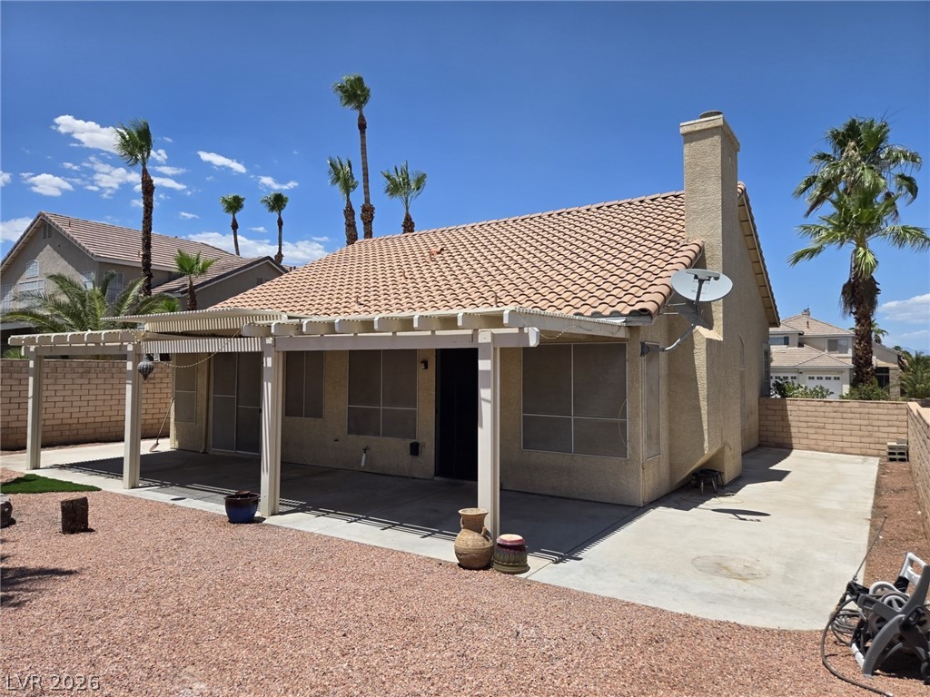 8417 San Ramon Drive Las Vegas, NV 89147 - Photo 32 of 33 An inviting covered patio and low-maintenance yard create a perfect outdoor retreat.
