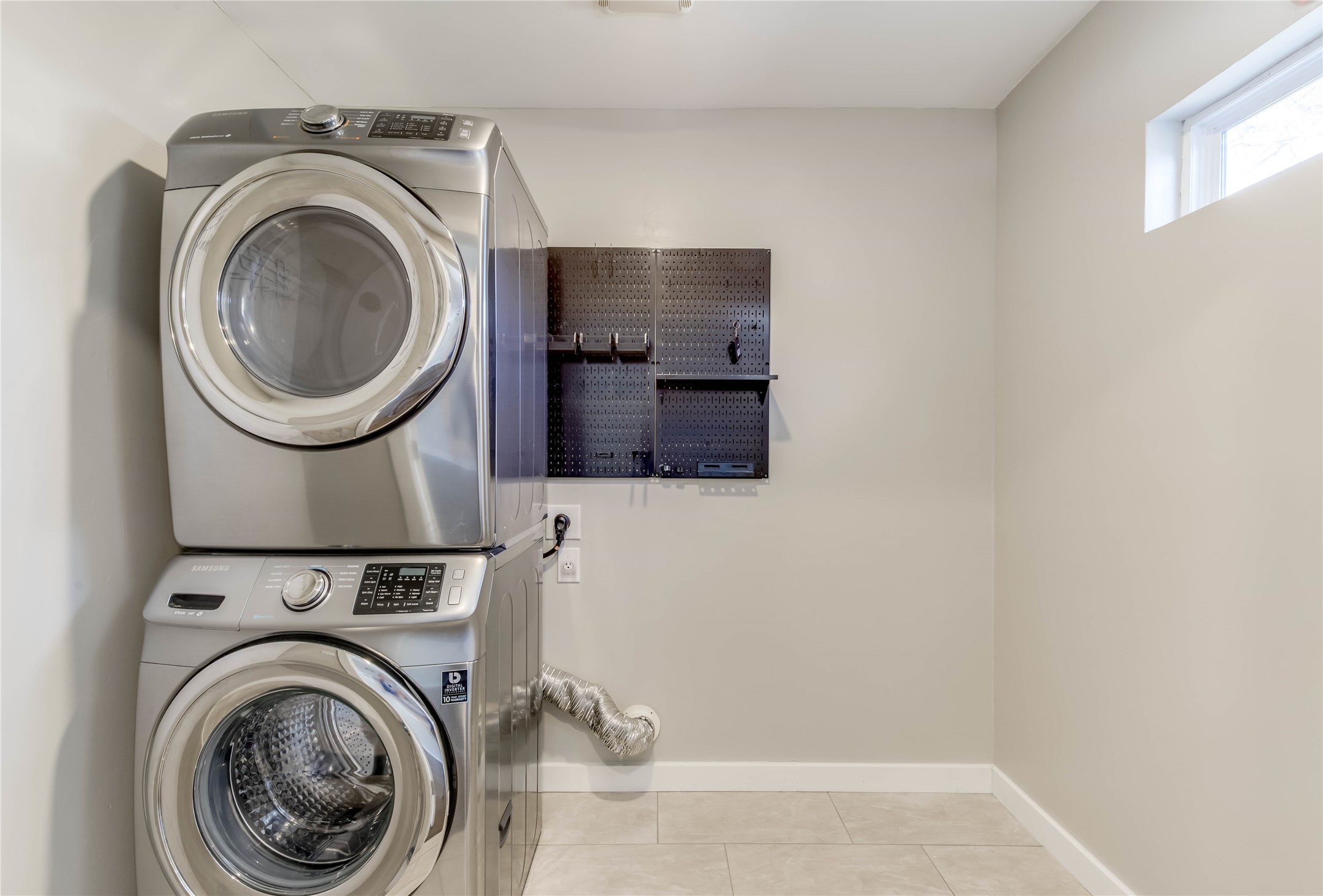 4702 Bandera Road Austin, TX 78721 - Photo 10 of 12 a view of a storage and utility room with washer and dryer