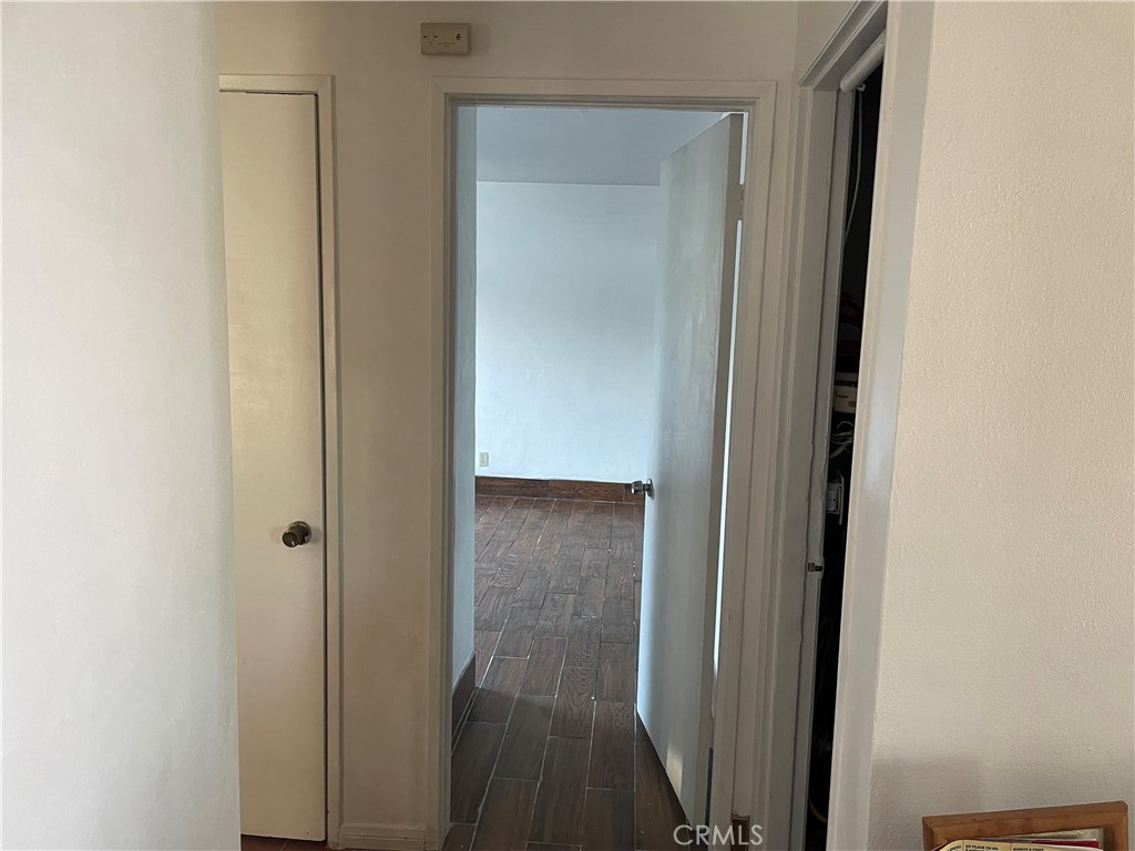 825 Sonora Road Costa Mesa, CA 92626 - Photo 13 of 37 a view of a hallway with wooden floor