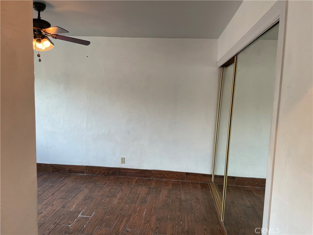 825 Sonora Road Costa Mesa, CA 92626 - Photo 15 of 37 a view of an empty room with wooden floor