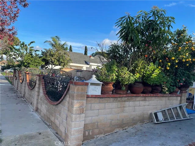 a view of a chairs and tables in the patio and a fire pit