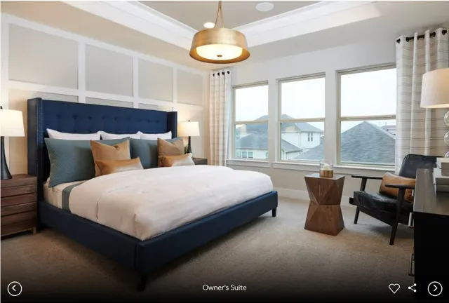 a bedroom with a bed and a table