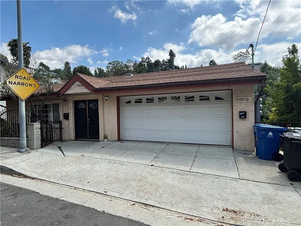 a front view of a house with a garage and a garage