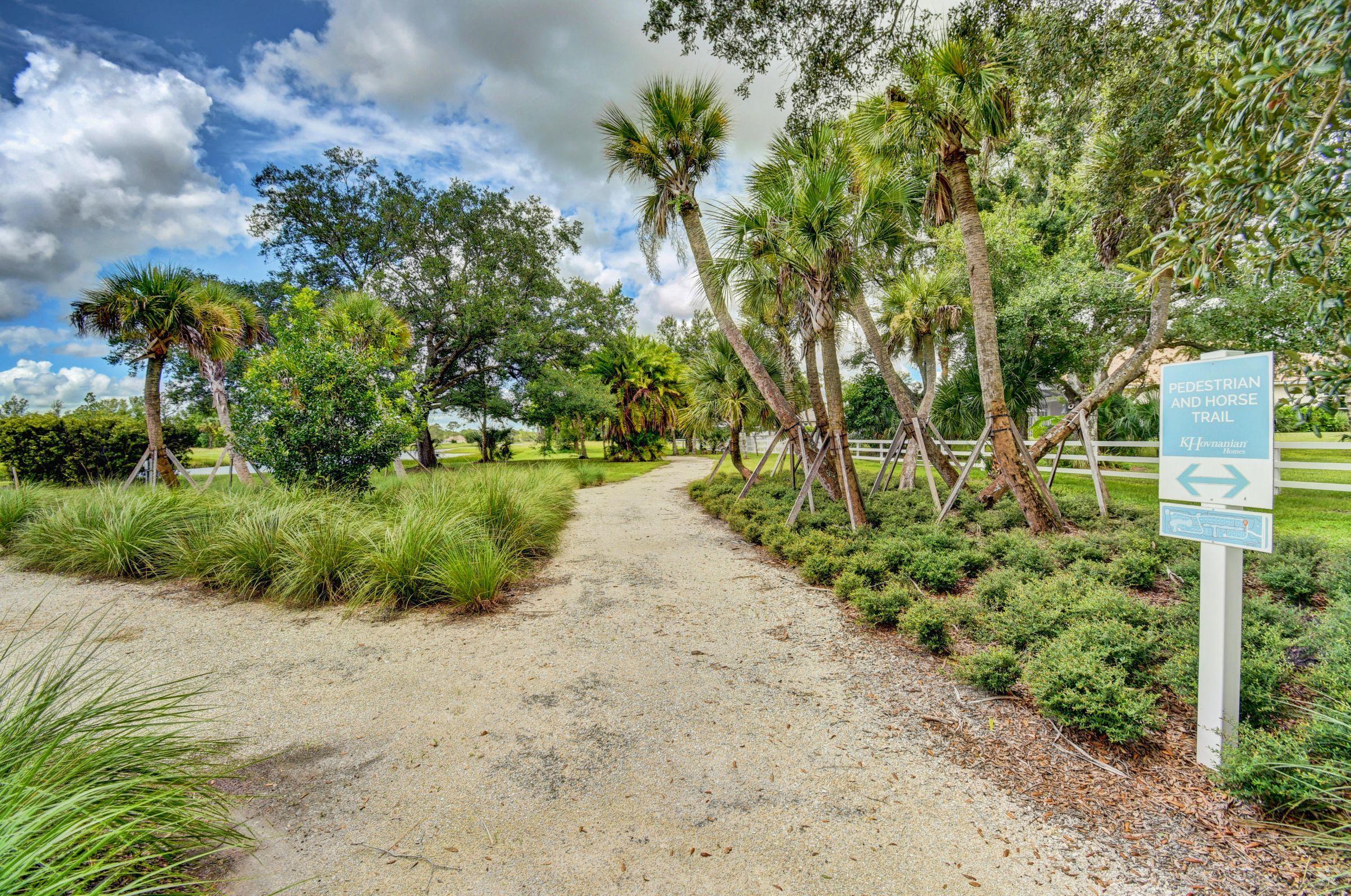 16127 Cadence Pass Jupiter, FL 33478 - Photo 55 of 59 a view of a garden with plants and trees