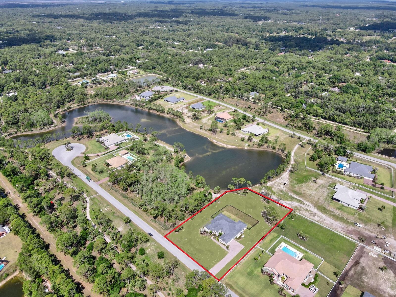 16127 Cadence Pass Jupiter, FL 33478 - Photo 59 of 59 an aerial view of a residential houses with outdoor space