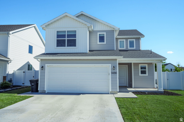 1486 West 2055th Street South Logan, UT 84339 - Photo 3 of 45 Two-story residence featuring light gray siding and white trim