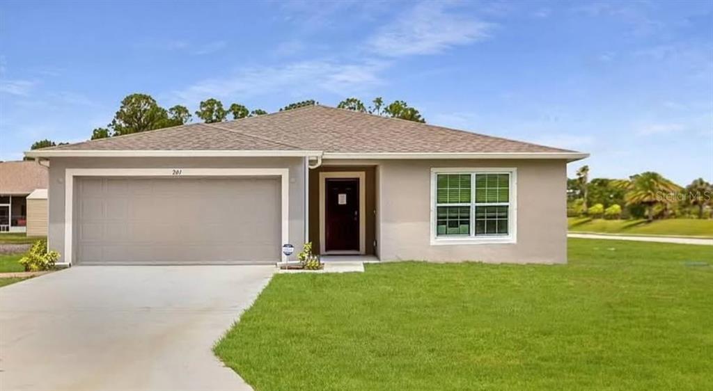 10072 North Conrad Point Citrus Springs, FL 34434 - Photo 1 of 23 a front view of a house with a yard and garage