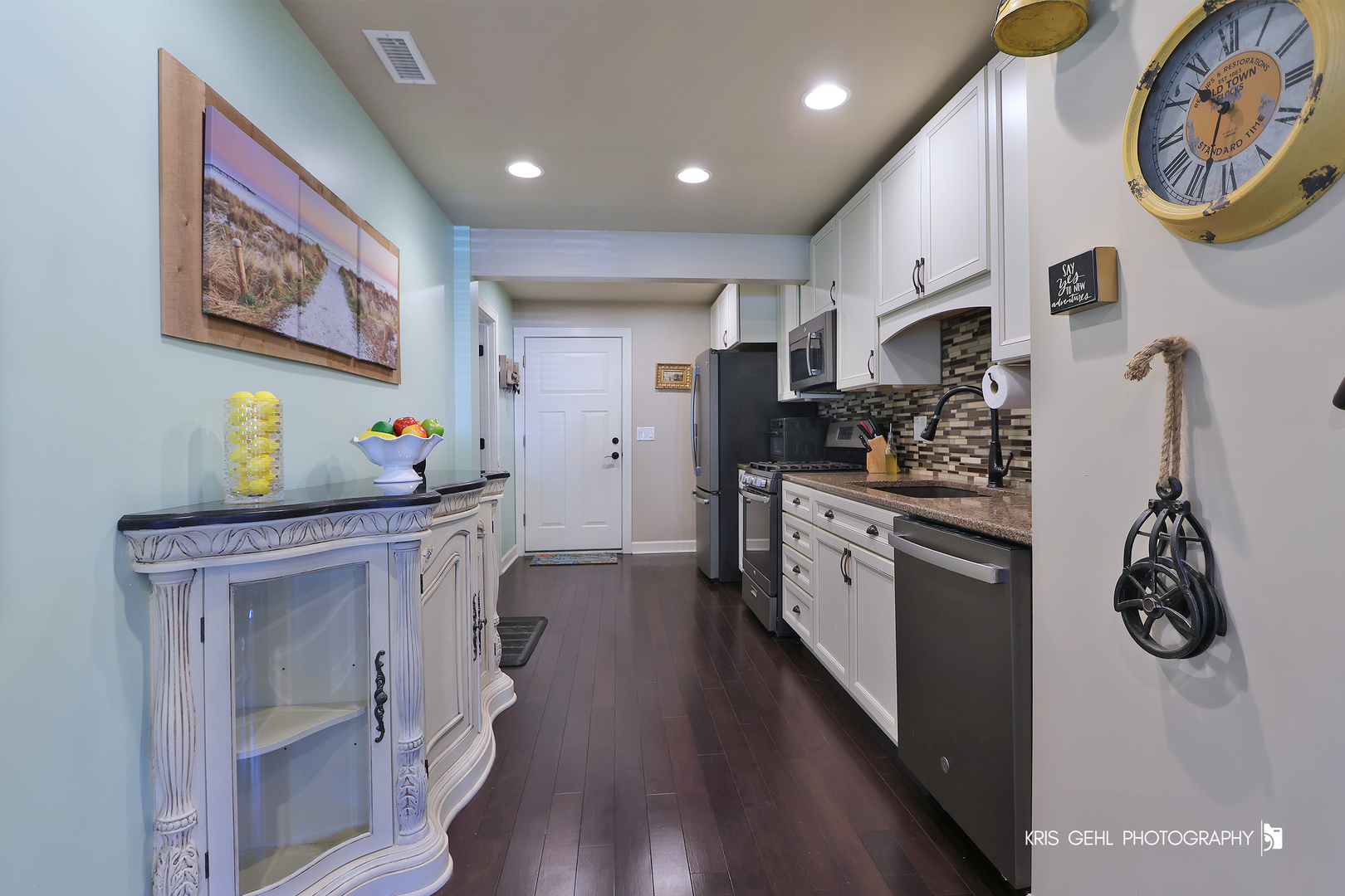 5310 Oak Park Road Oakwood Hills, IL 60013 - Photo 8 of 17 a kitchen with stainless steel appliances a white cabinets and wooden floor