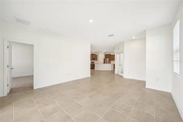 a view of a kitchen with microwave and cabinets