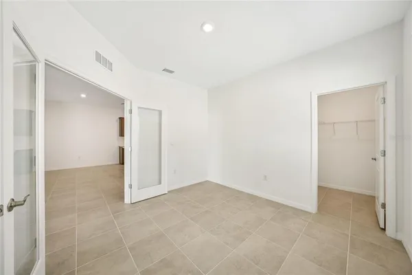 a kitchen with a sink a counter top space stainless steel appliances