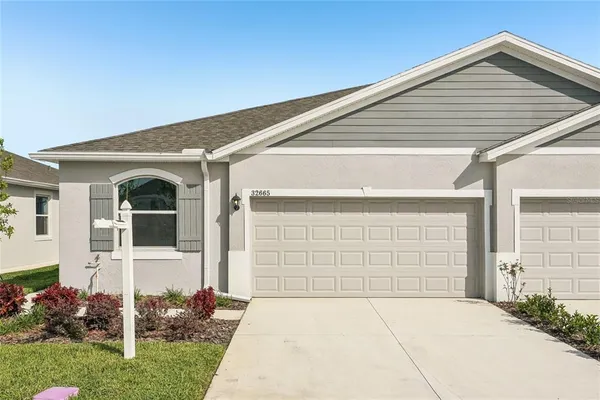 an aerial view of a house with a ocean view