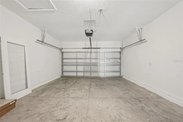 a view of a swimming pool with a lawn chairs