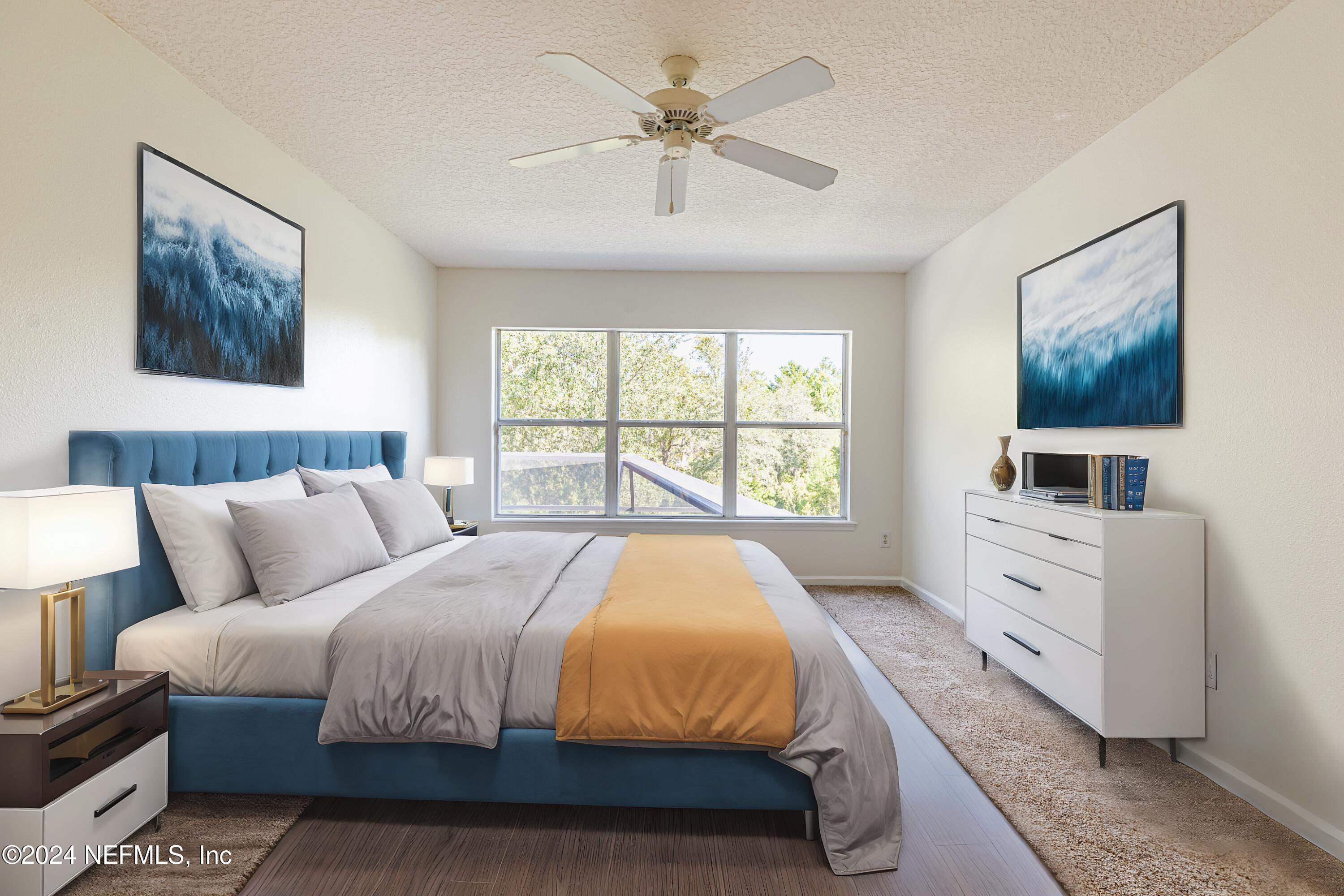 156 Bilbao Drive St. Augustine, FL 32086 - Photo 37 of 57 a spacious bedroom with a large bed and a window