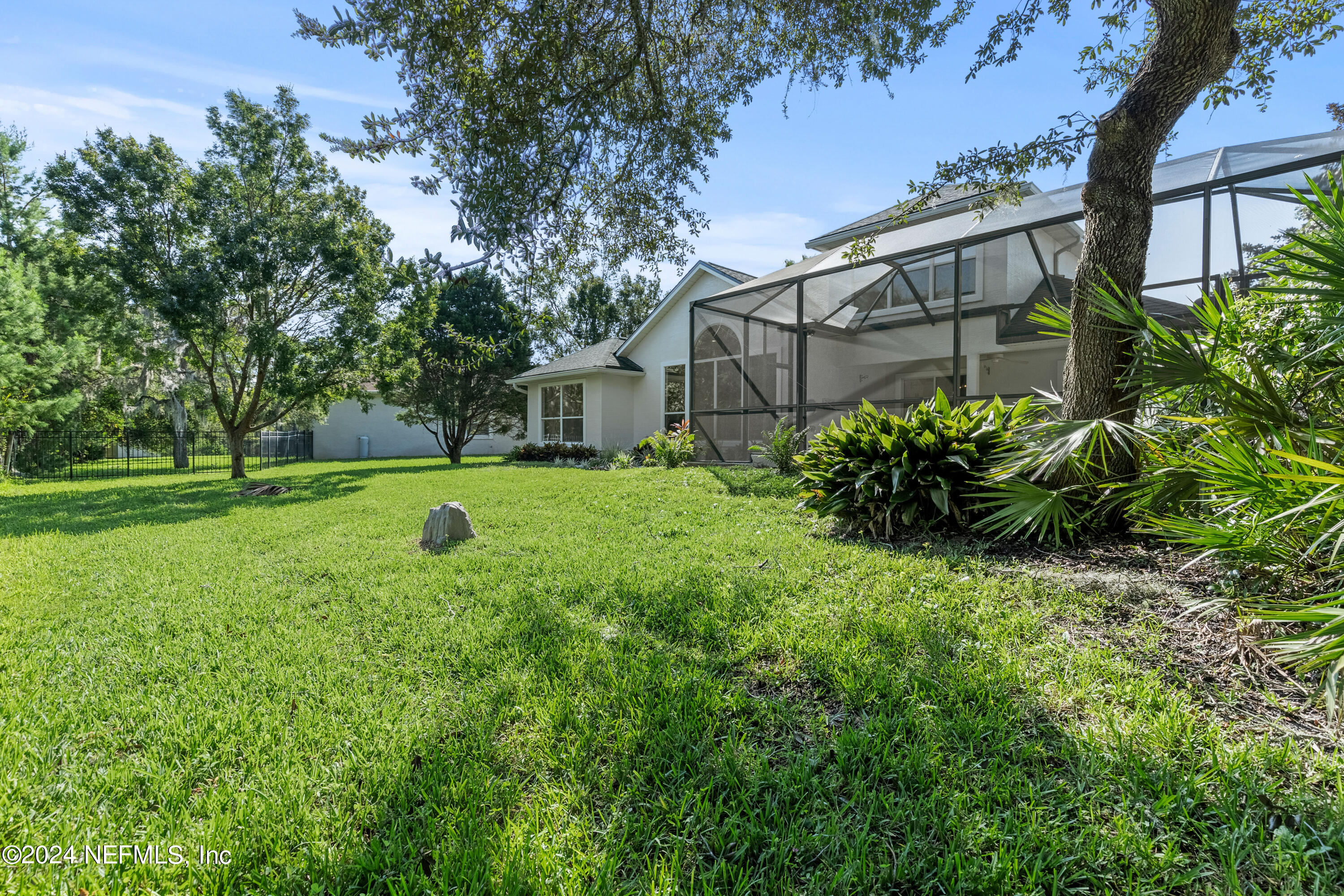 156 Bilbao Drive St. Augustine, FL 32086 - Photo 54 of 57 a view of a backyard with a garden