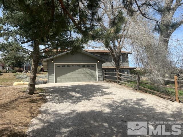 105 Cheyenne Drive Reno, NV 89521 - Photo 1 of 25 a view of a house with a tree in the background