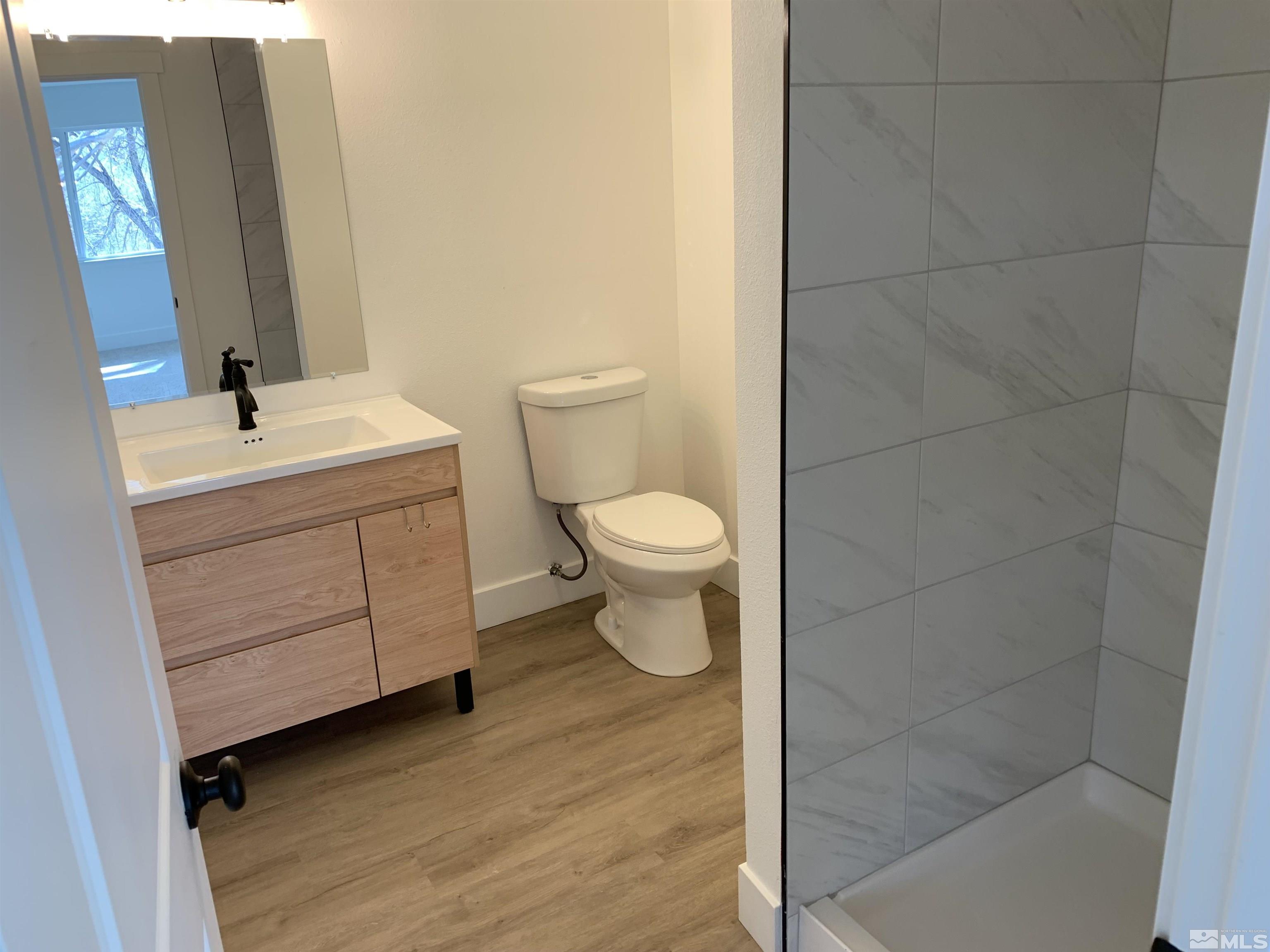 105 Cheyenne Drive Reno, NV 89521 - Photo 11 of 25 a bathroom with a sink a toilet and mirror
