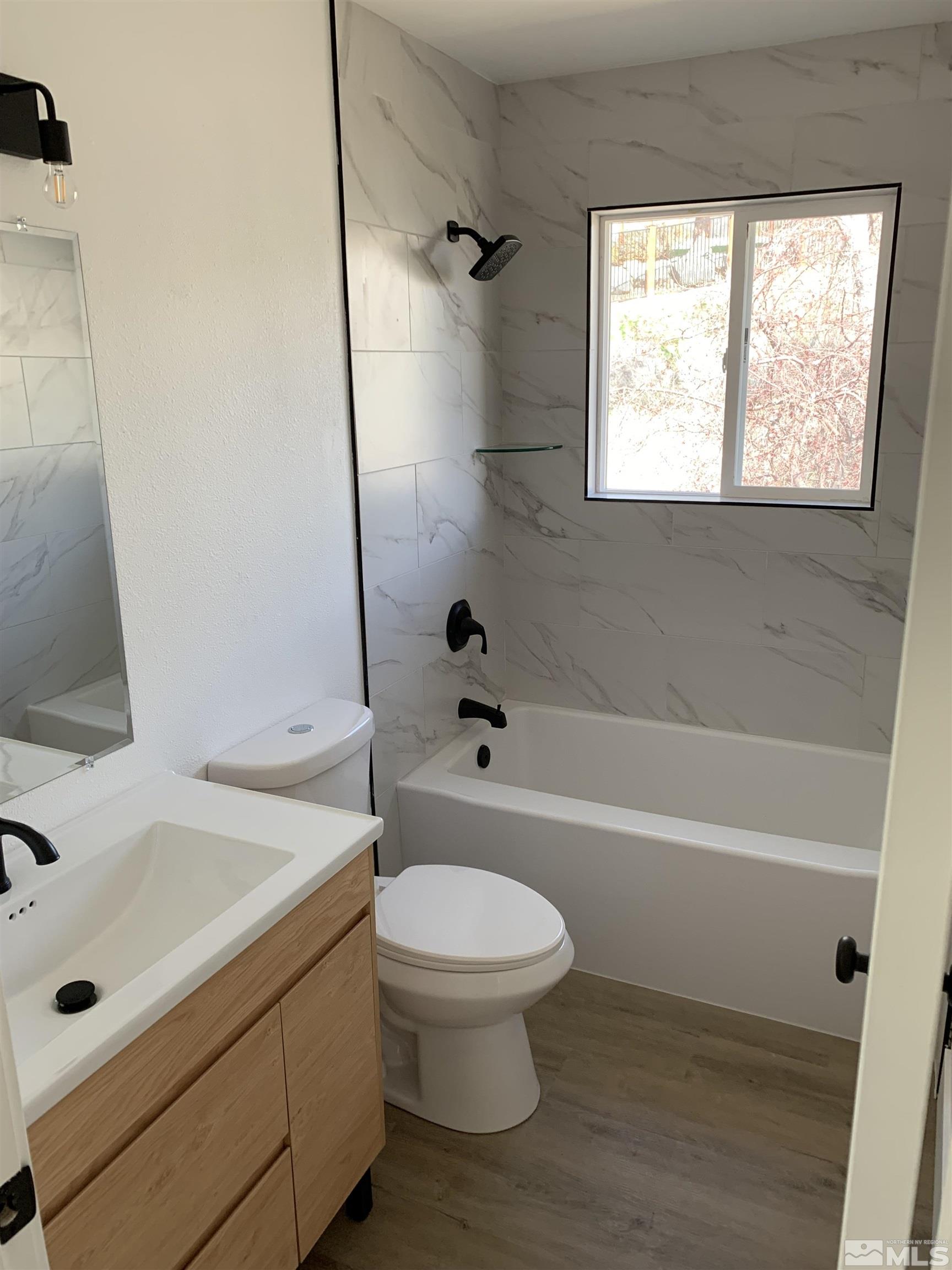 105 Cheyenne Drive Reno, NV 89521 - Photo 14 of 25 a bathroom with a sink a toilet and a bathtub