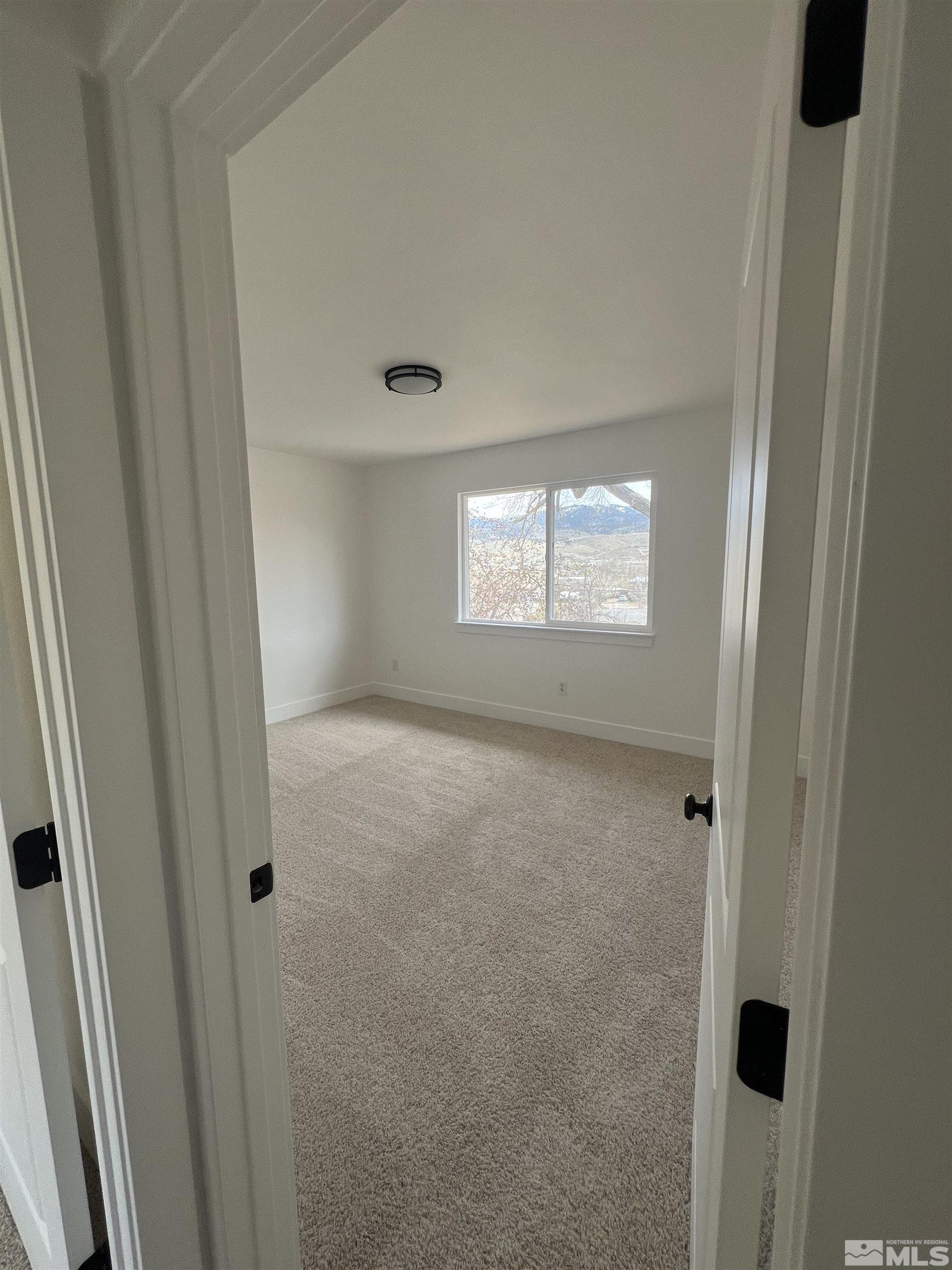 105 Cheyenne Drive Reno, NV 89521 - Photo 15 of 25 a view of an empty room with a window
