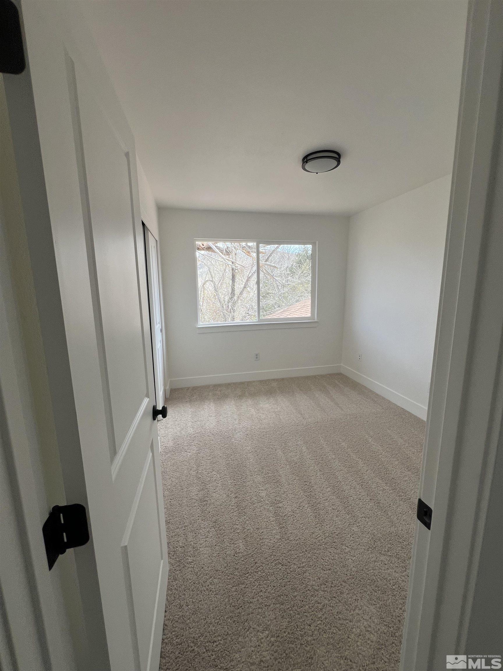 105 Cheyenne Drive Reno, NV 89521 - Photo 17 of 25 a view of room with window and hardwood floor
