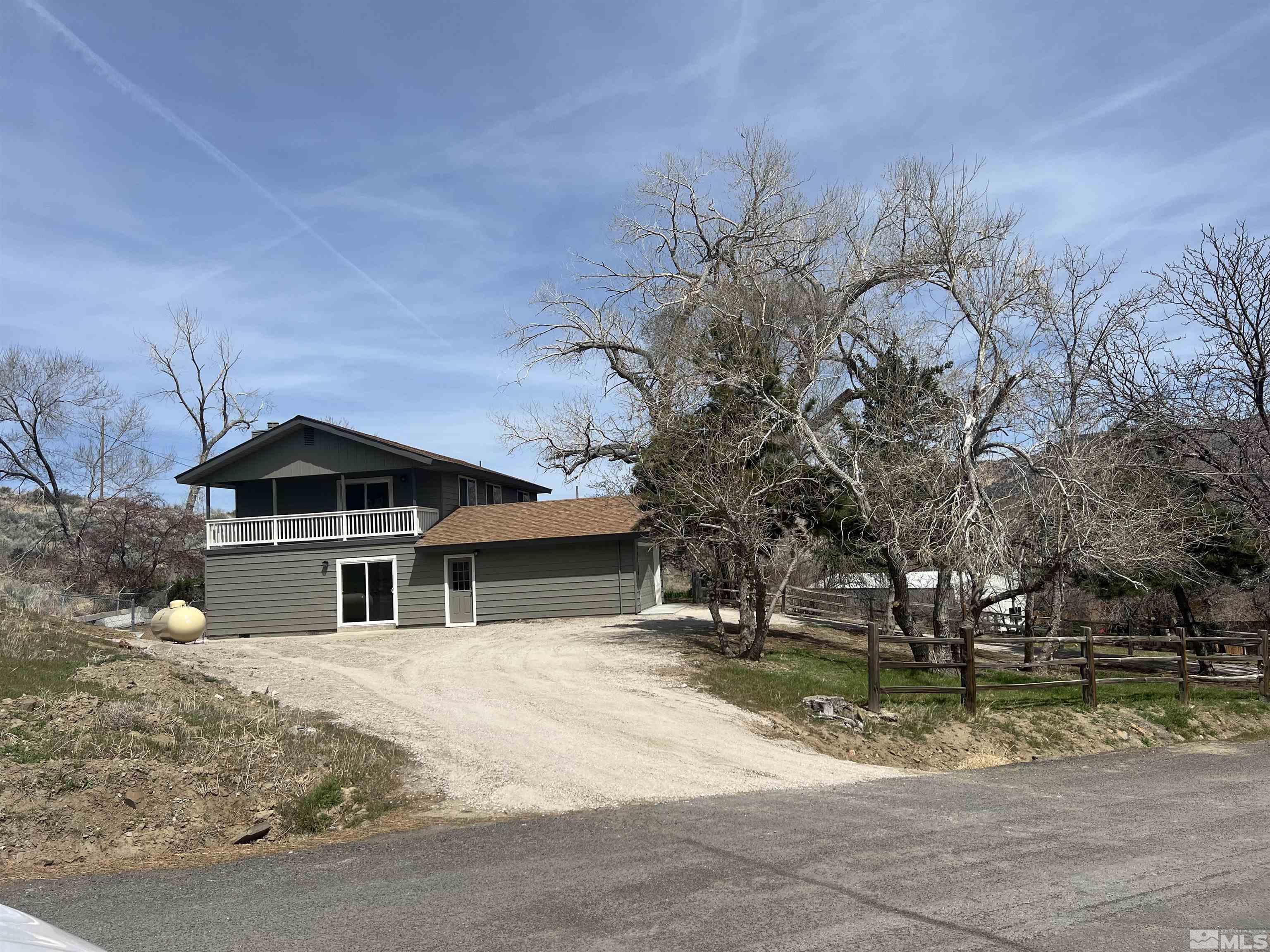 105 Cheyenne Drive Reno, NV 89521 - Photo 19 of 25 a front view of a house with a yard