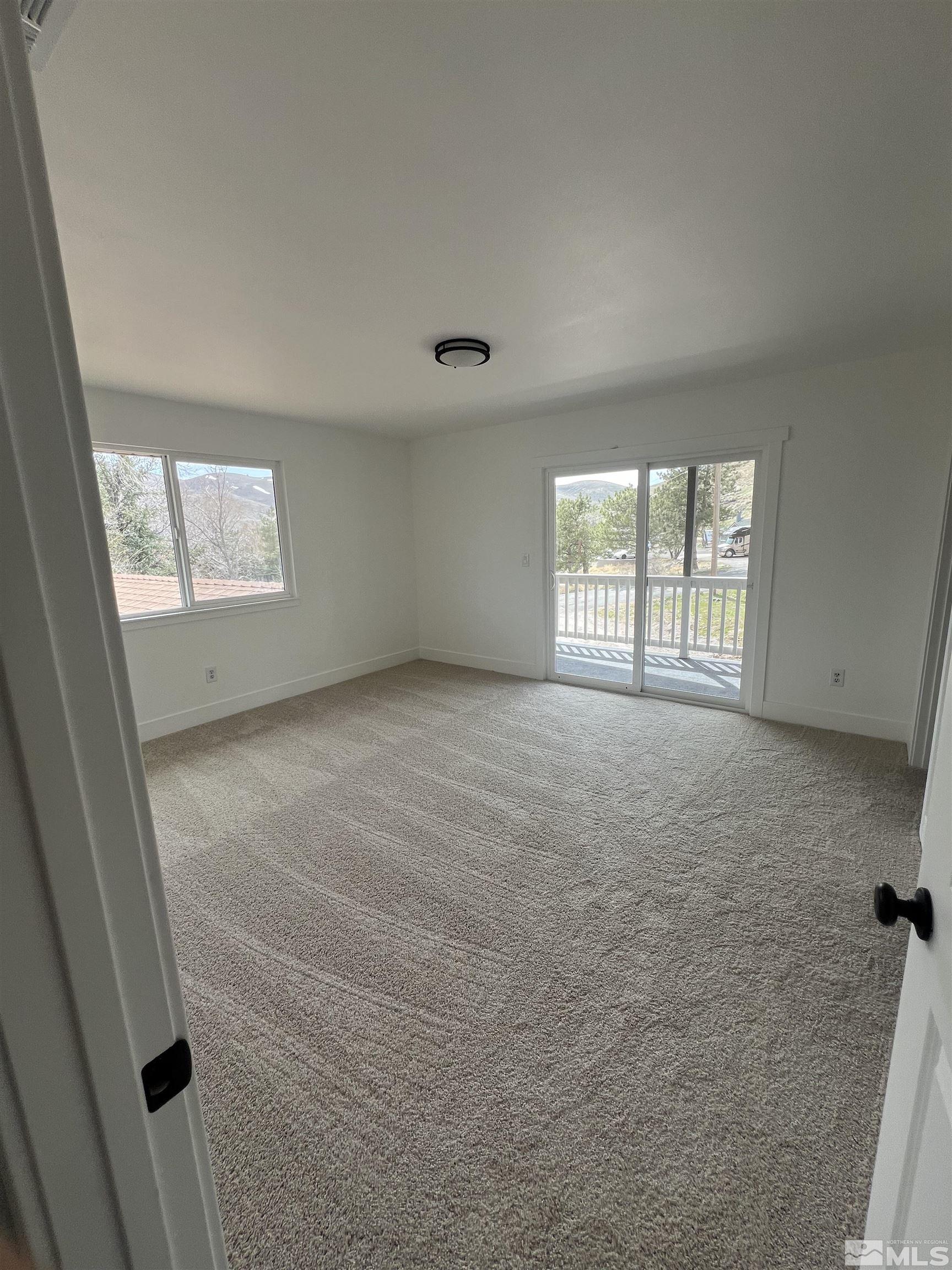 105 Cheyenne Drive Reno, NV 89521 - Photo 9 of 25 an empty room with windows