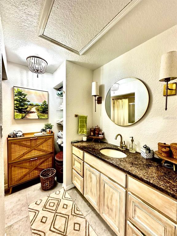 4749 Sunny Loop, Unit 4749 Holiday, FL 34690 - Photo 17 of 34 a bathroom with a sink and a mirror