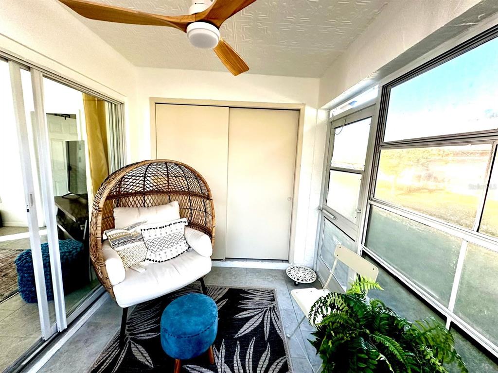 4749 Sunny Loop, Unit 4749 Holiday, FL 34690 - Photo 22 of 34 a living room with furniture and a potted plant