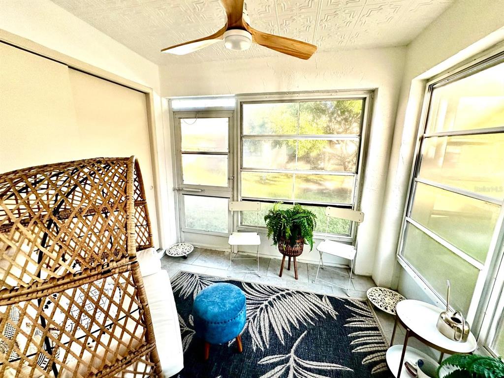4749 Sunny Loop, Unit 4749 Holiday, FL 34690 - Photo 23 of 34 a living room with furniture and a large window