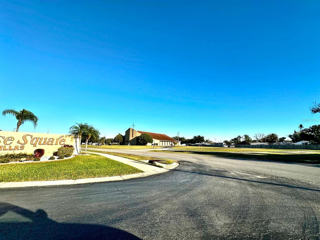 4749 Sunny Loop, Unit 4749 Holiday, FL 34690 - Photo 31 of 34 a view of a swimming pool and an outdoor space