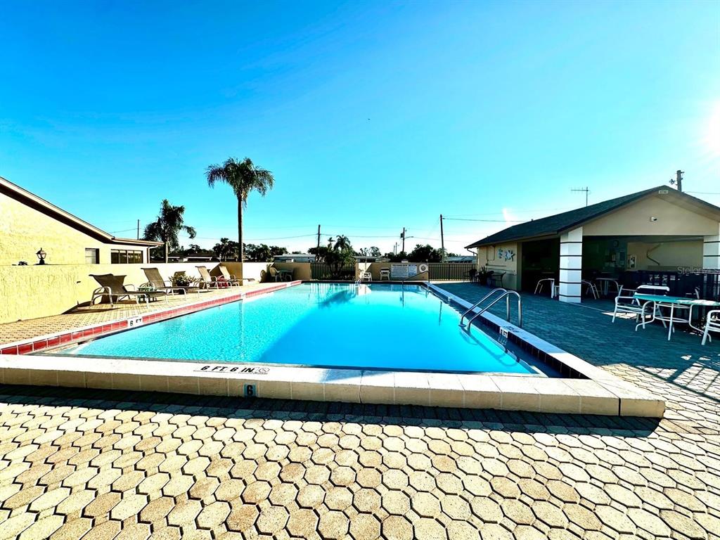 4749 Sunny Loop, Unit 4749 Holiday, FL 34690 - Photo 5 of 34 a view of swimming pool with chairs