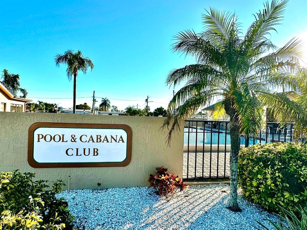 4749 Sunny Loop, Unit 4749 Holiday, FL 34690 - Photo 6 of 34 a sign on the side of a building